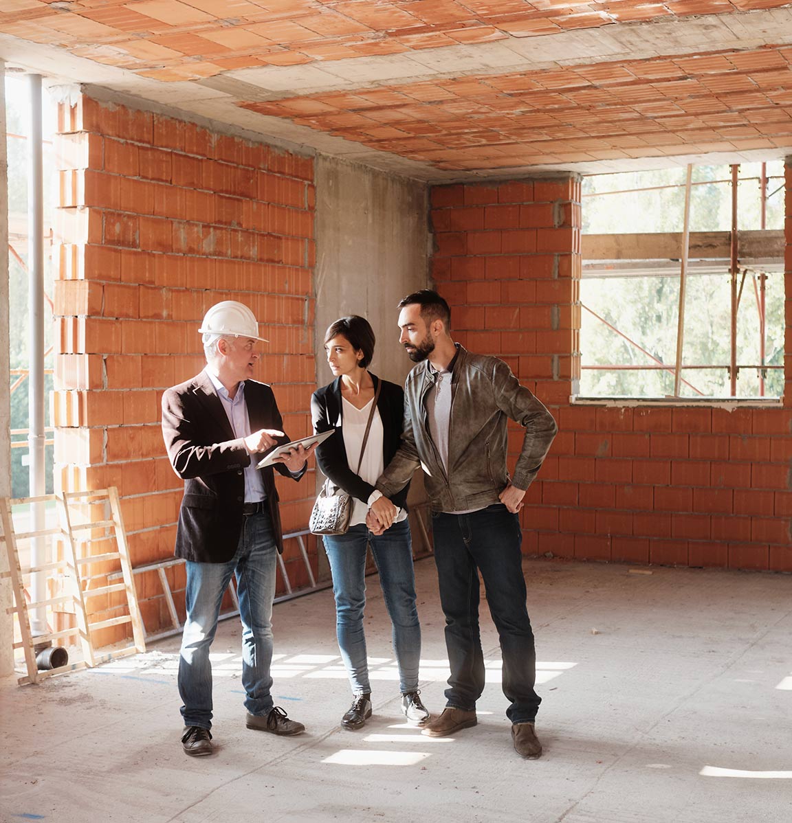 A builder meets with prospective owners